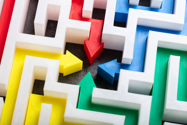 istock Multi Colored Arrows In The Center Of Maze 1136317191