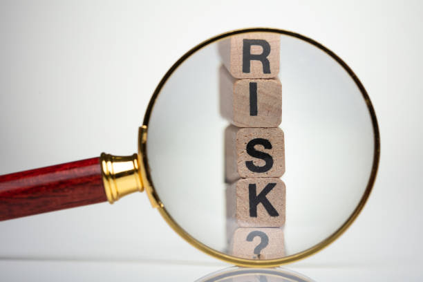 istock Risk Word With Help Of Magnifying Glass 1136317196