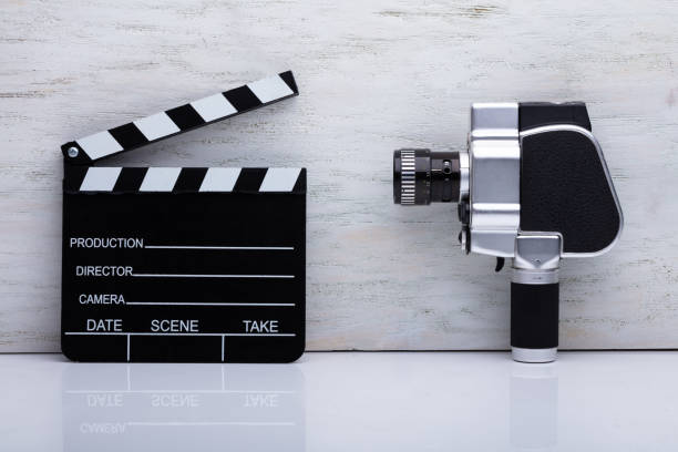 istock Movie Camera And Clapper Board 1136317306