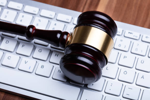istock Wooden Gavel On Keyboard 1136317687