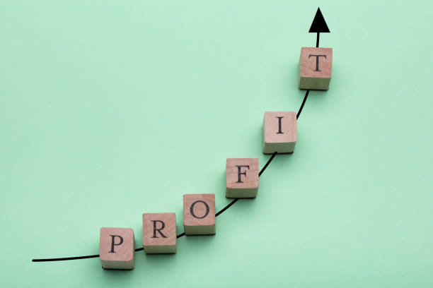 istock Wooden Blocks With The Word Profit Arranged On Increasing Graph 1136317766