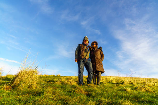 istock Senior couple walking on countryside path in winter 1136320773