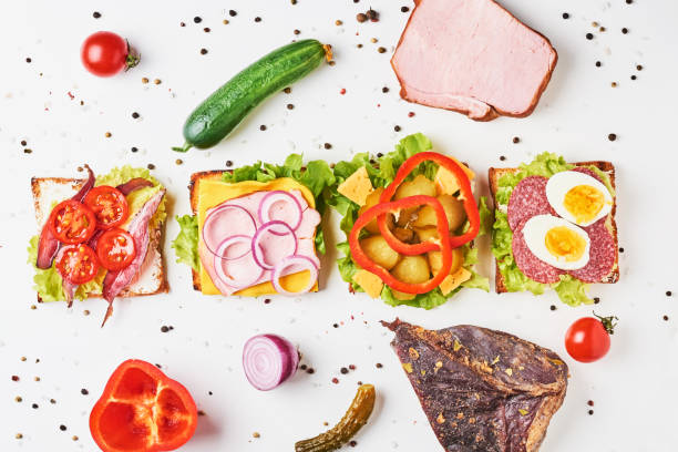 istock Different kind of sandwich and ingredients on a white background, top view 1136323105