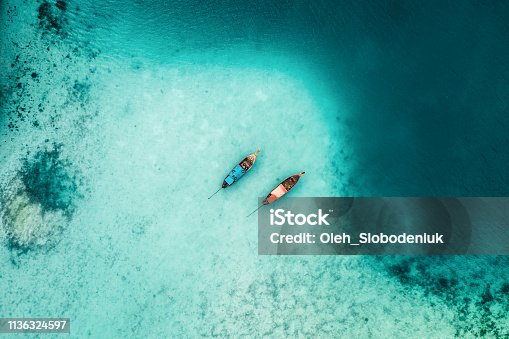 istock Scenic aerial view of two boats on sea in Thailand 1136324597
