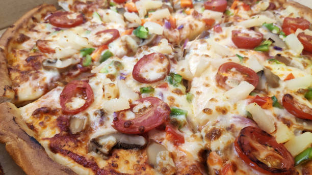 istock Pizza with mushrooms, tomato and pineapple 1136329058