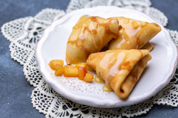 istock Crepes in the form of triangles stuffed with apples. 1136331596