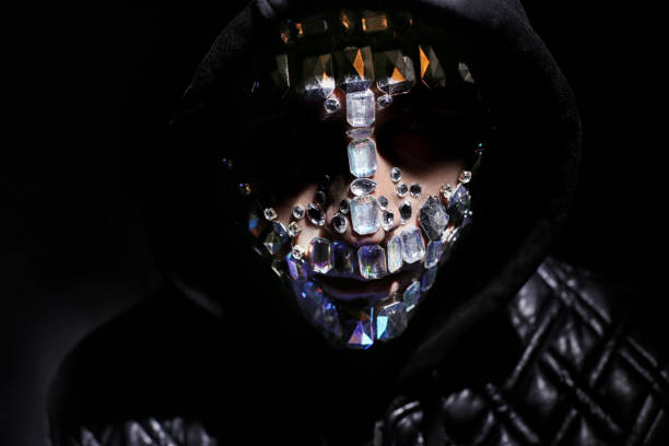Art Portrait Of A Hooded Man With Big Rhinestones On His Face Mysterious  Mystical Appearance Of A Man Big Crystals Glisten In The Dark On The Guy  Face Blurred Out Of Focus