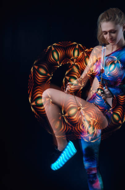 istock girl dancing light show 1136336638
