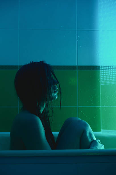 istock Young woman washing in bath at home. 1136342383
