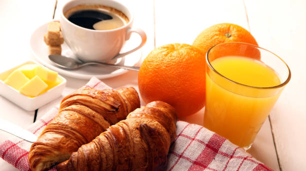 istock Breakfast with coffee, orange juice, butter and croissants 1136343545