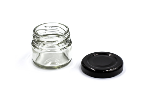 Empty glass jar isolated on white background