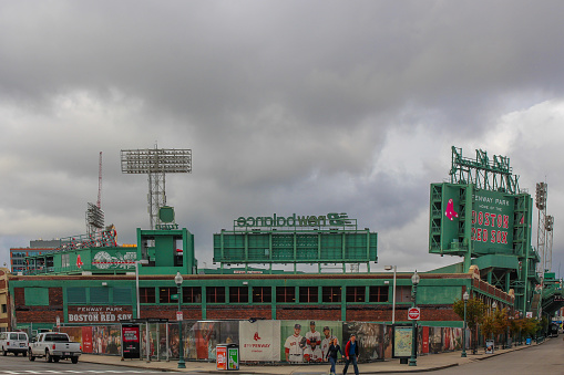 Boston, United States 10/04/2016 Fenway park home of Boston Red Sox baseball stadium with the famous green color attracking sports lovers from all over the world under an impressives grey sky