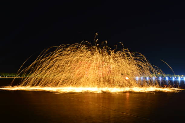 istock Molten steel in the high temperature melt splashing sparks 1136344154