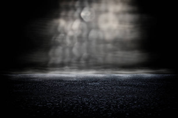istock Spotlight over concrete floor. dark black background 1136345551