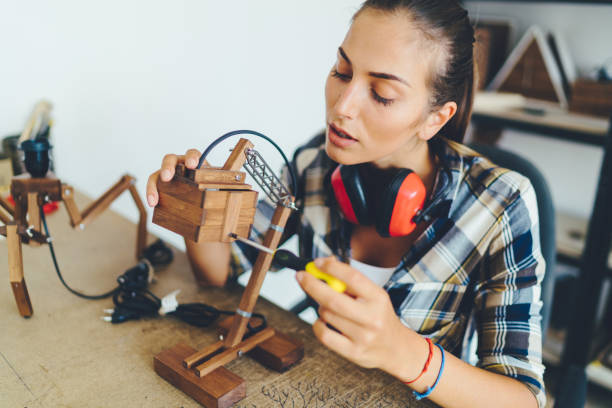 Carpenter working on handmade wooden lamp