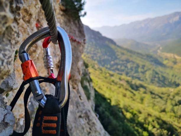 Carabiner in via ferrata, iron path Carabiner in a via ferrata (iron path) in Spain carabiner stock pictures, royalty-free photos & images