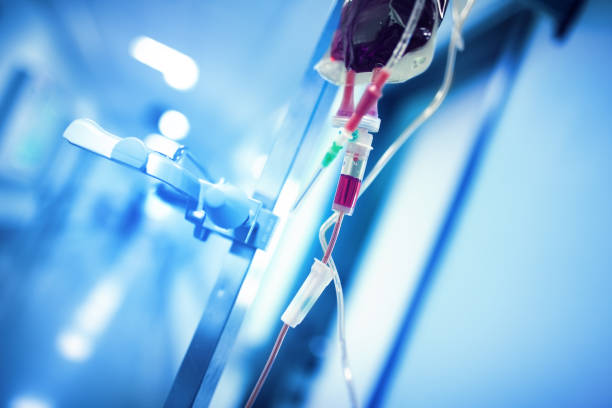 istock Blood transfusion system hanging on the iron pole ready to use in the hospital hall 1136350875