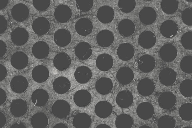 istock Round-hole grid close-up as a industrial textured background 1136350908