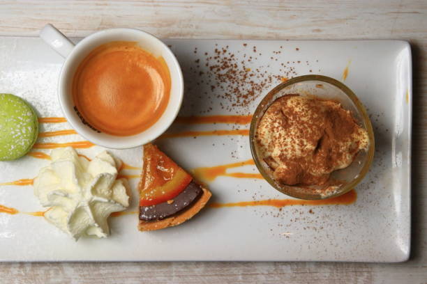 istock gourmet coffee with macaron, chantilly and tart 1136355555