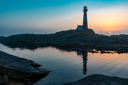 The lighthouse during sunset at Peggy's Cove, along the coast of Nova Scotia, Canada. Shot with a Canon 5D Mark IV.
