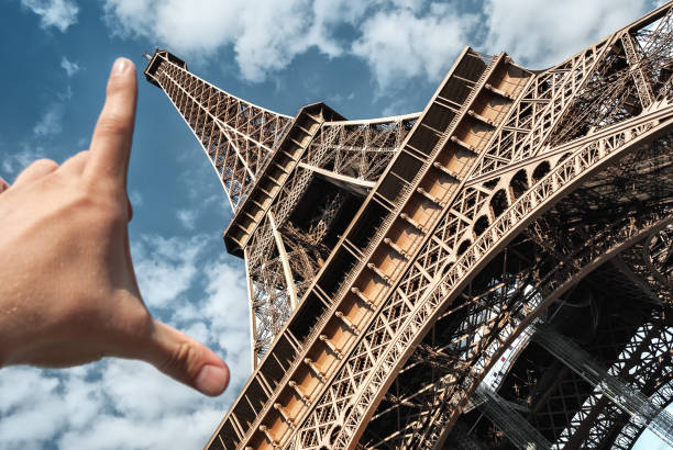 istock Eiffel tower in Paris on blue sky measuring tower palm 1136358018