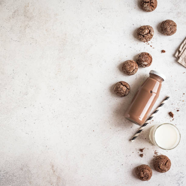Chocolate and White Milk and Chocolate Cookies on white marble table, copy space.