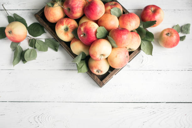 istock Red apples in wooden box 1136358384