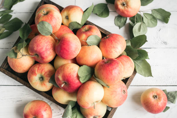 istock Red apples in wooden box 1136358443
