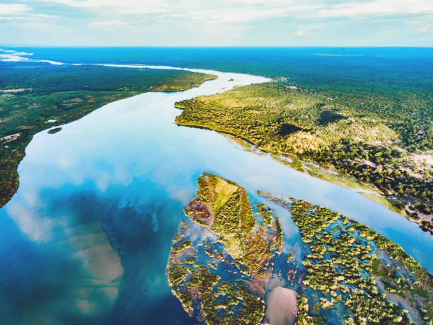 aerial view on the zambezi under blue sky aerial view on the river of lower zambezi area in Zambia flood plain photos stock pictures, royalty-free photos & images