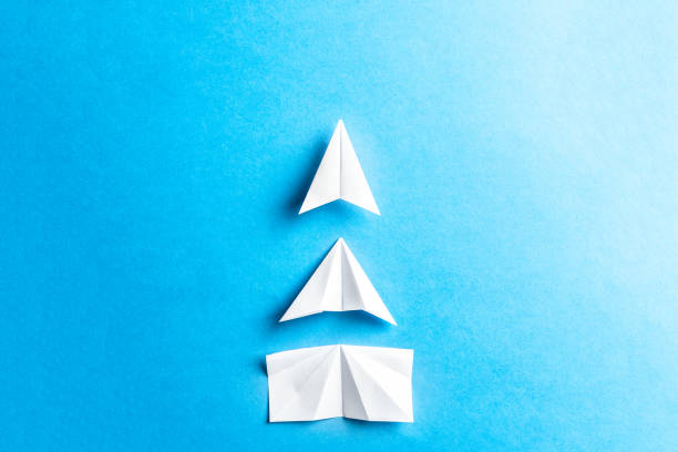 istock Development attainment, motivation, growth concept. Business concept of goals, success, achievement and challenge. White paper airplanes under construction on blue background. Horizontal composition. 1136359778