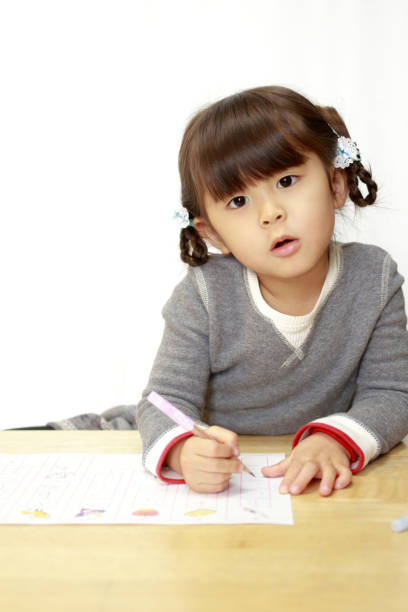 istock studying Japanese girl (4 years old) 1136360808