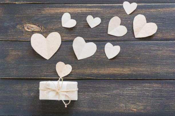 istock hearts and gift wrapped paper. Flat lay, top view. 1136362097