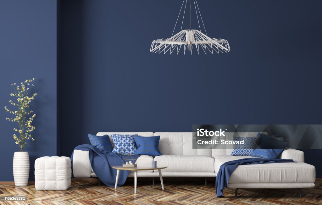 Interior of modern living room with white fabric sofa over blue wall 3d rendering Interior of modern living room with white fabric sofa, coffee table and plant over blue wall 3d rendering Living Room Stock Photo