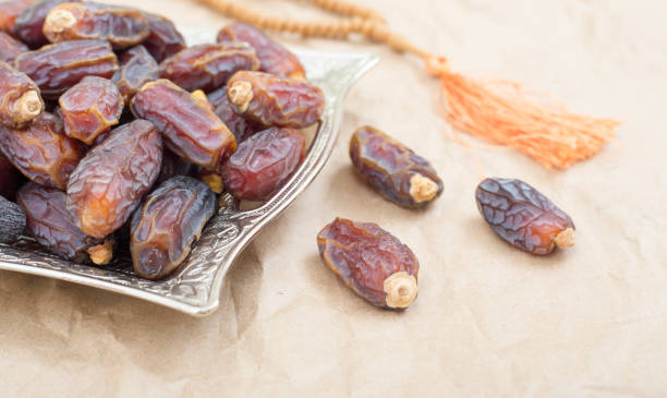 istock Palm tray and prayer beads for Ramadan 1136363856