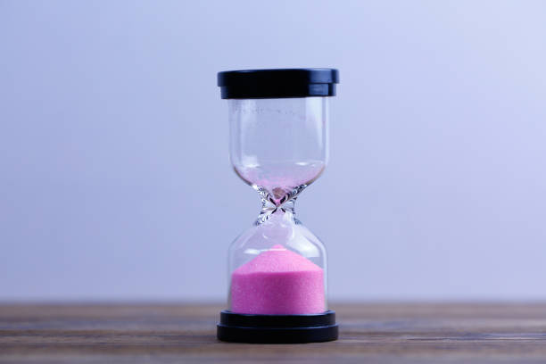 istock An hourglass.  Running out of time 1136366501