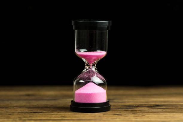 istock An hourglass.  Running out of time 1136367231