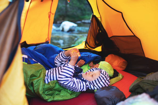 istock Children camping in mountains 1136370875