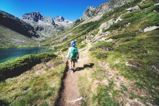 istock Father and son hiking together in mountains 1136371001
