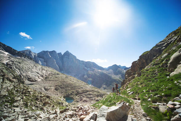 istock Family hiking in mountains 1136371264