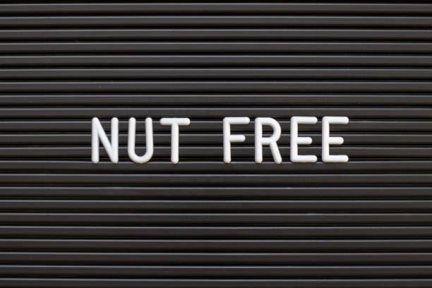 istock Black color felt letter board with white alphabet in word nut free background 1136372057