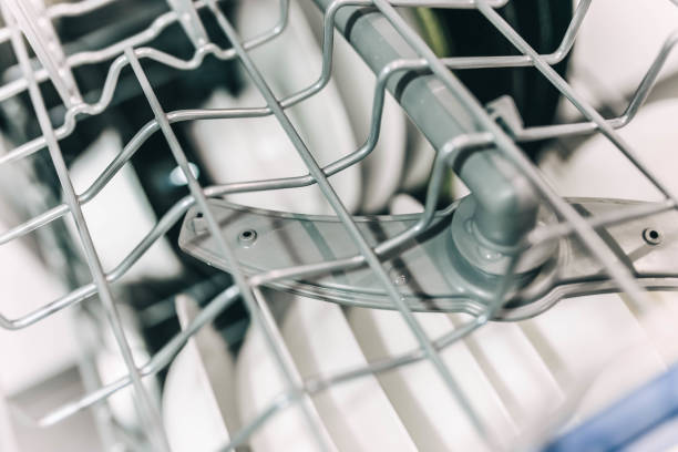 Dishwasher detail with water spray household appliances inside, stock photo