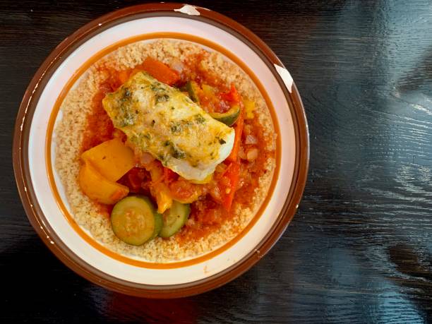 Couscous with vegetable and fish stock photo