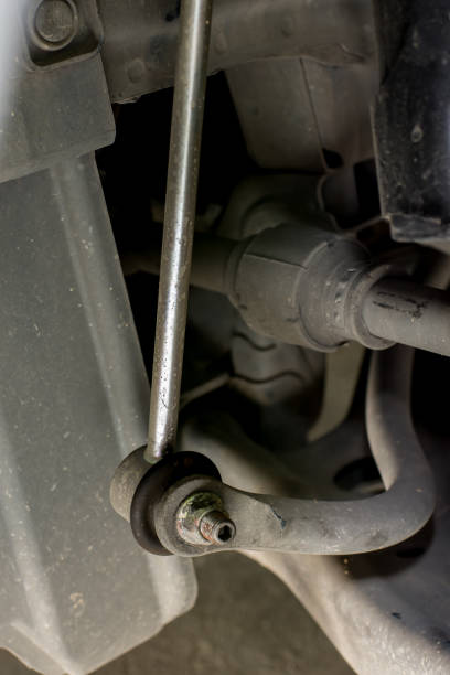 istock Close up of new stabilizer link on old car 1136378131