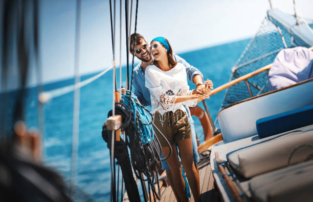 istock Young couple on a sailing cruise. 1136378496