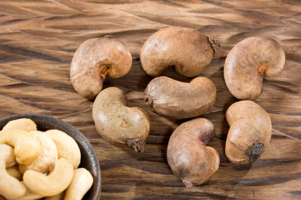istock Cashew nut on wooden background - Anacardium occidentale 1136379508