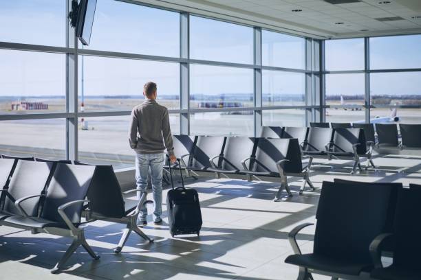 istock Traveler in airport terminal 1136382158