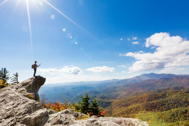 istock Man walking on the edge of a cliff 1136383230