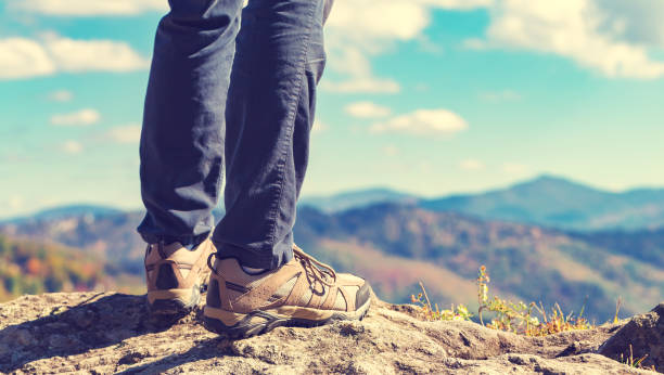 istock Man at the edge of a cliff 1136383234