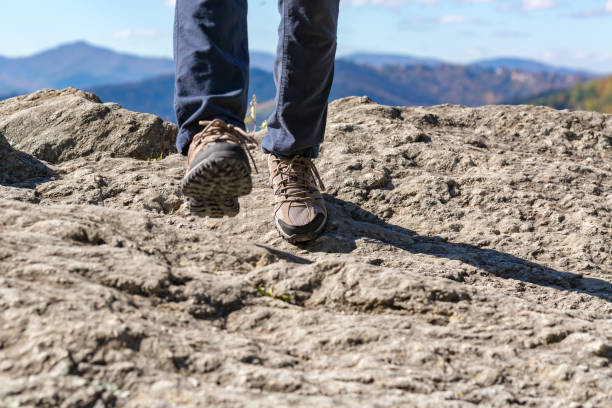 istock Man at the edge of a cliff 1136383241