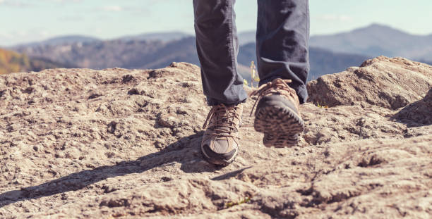 istock Man at the edge of a cliff 1136383250
